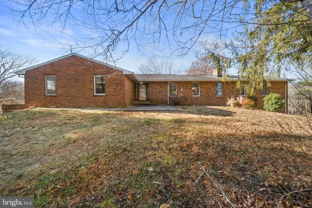 a view of house with yard