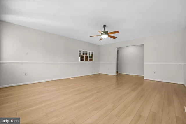 a view of room with window and ceiling fan