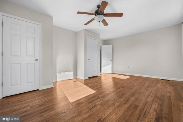 a kitchen with stainless steel appliances wooden cabinets and a stove top oven