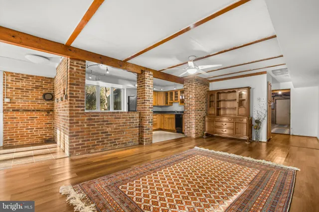 a bed sitting in a bedroom next to a cabinet