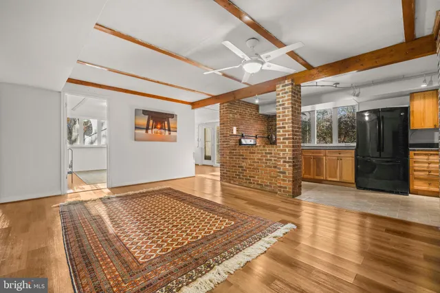 a view of a kitchen with white cabinets and white appliances