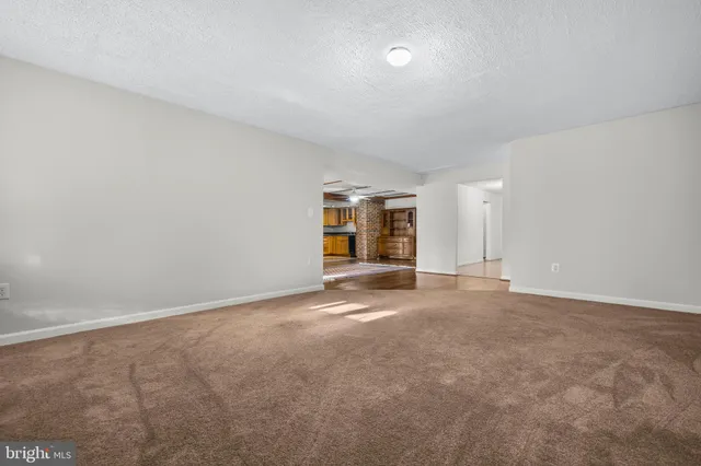 a view of a balcony with wooden floor and outdoor space