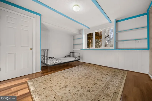 a view of a roof deck with wooden floor and outdoor seating