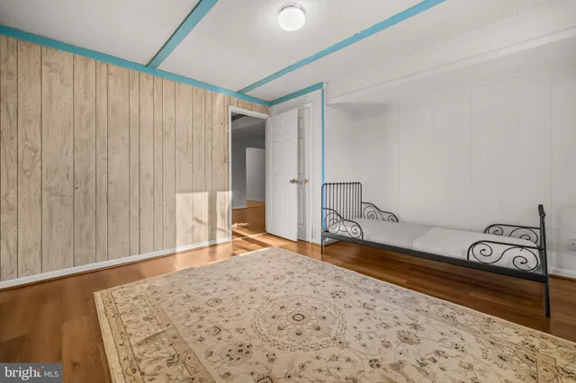 a view of a roof deck with wooden floor and fence
