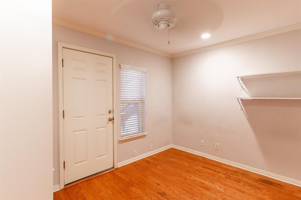 3009 Speedway, Unit 2 Austin, TX 78705 - Photo 8 of 10 Hardwood flooring extends throughout this versatile space, featuring a private entrance and built-in shelving.