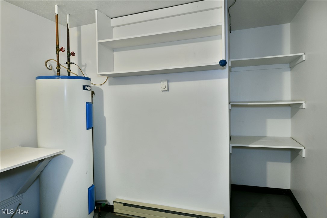 379 Housel Craft Road Bristolville, OH 44402 - Photo 43 of 50 Utilities featuring a baseboard heating unit and water heater
