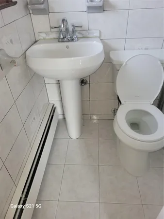 a bathroom with a toilet and shower
