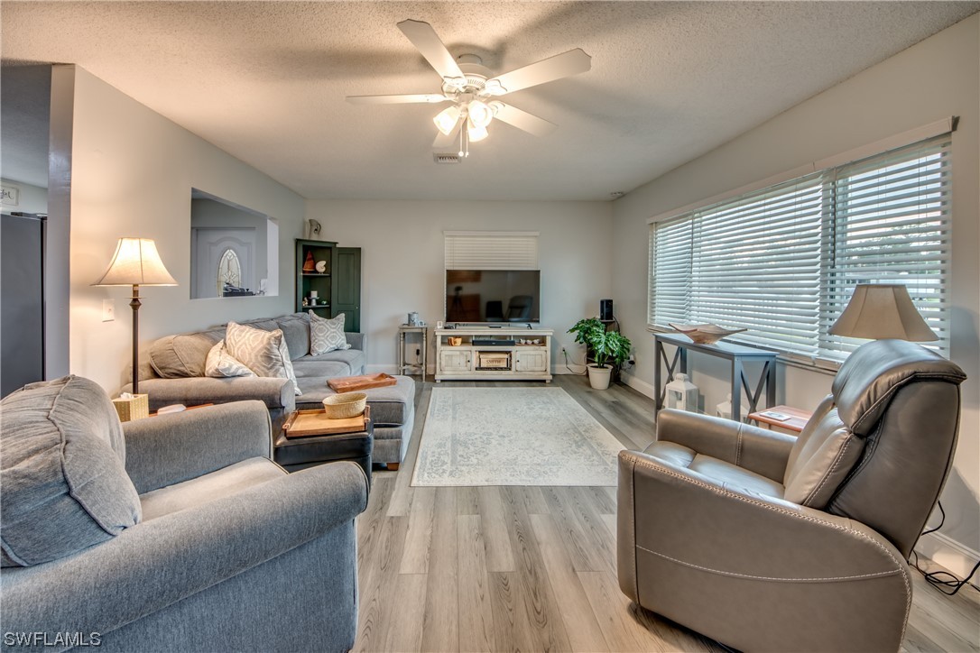 26508 Eager Road Punta Gorda, FL 33955 - Photo 3 of 41 a living room with furniture and a flat screen tv