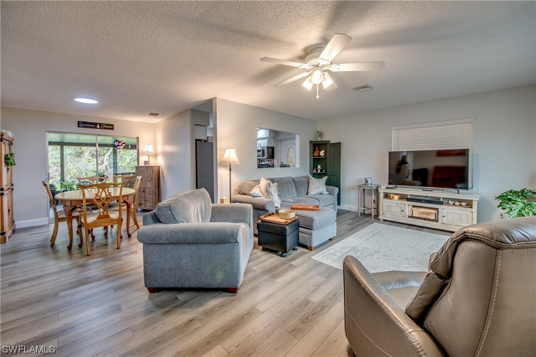 26508 Eager Road Punta Gorda, FL 33955 - Photo 5 of 41 a living room with furniture and a flat screen tv