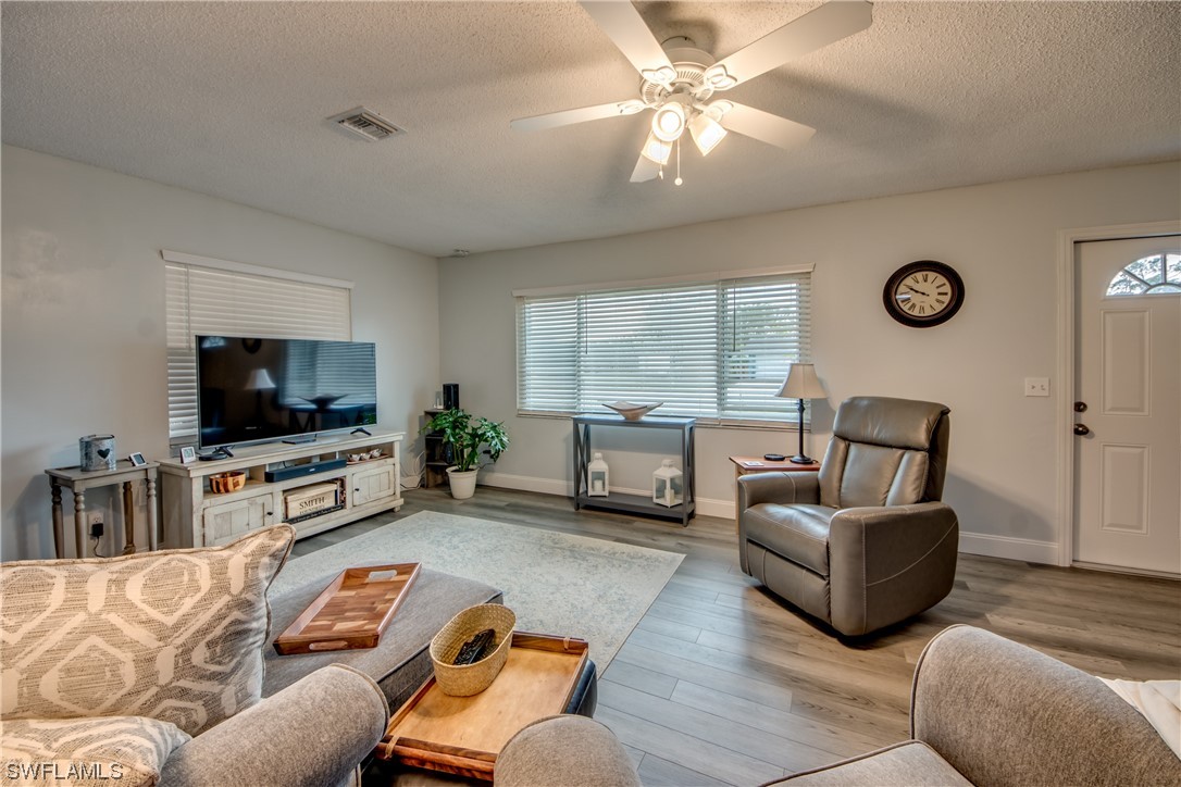 26508 Eager Road Punta Gorda, FL 33955 - Photo 7 of 41 a living room with furniture and a flat screen tv