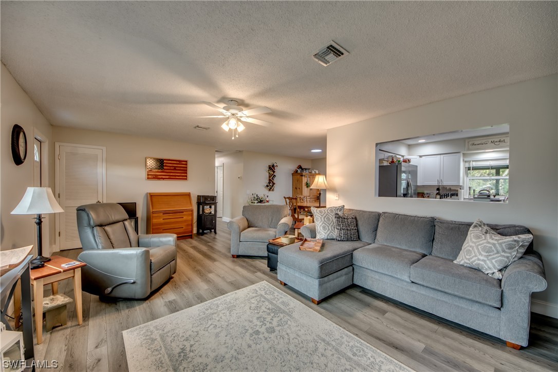 26508 Eager Road Punta Gorda, FL 33955 - Photo 8 of 41 a living room with furniture and a lamp