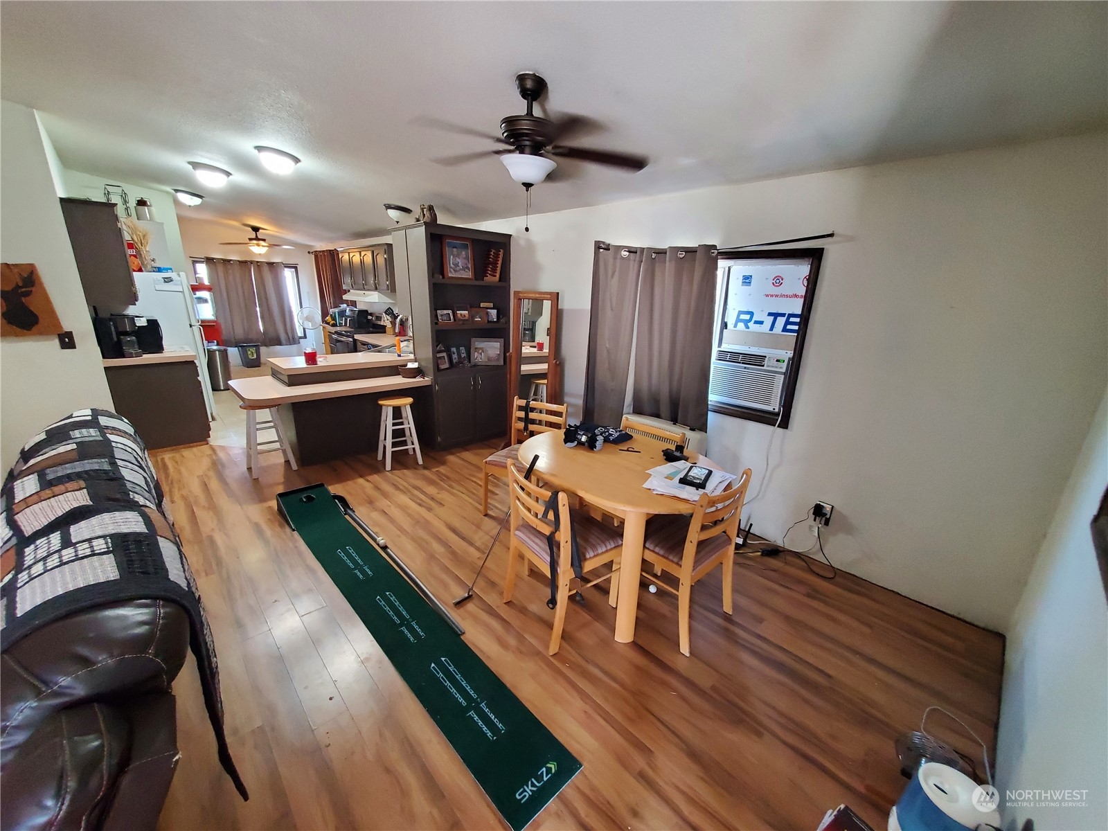 507 Mt Olive Road Riverside, WA 98849 - Photo 11 of 23 a view of a dining room with furniture window and wooden floor