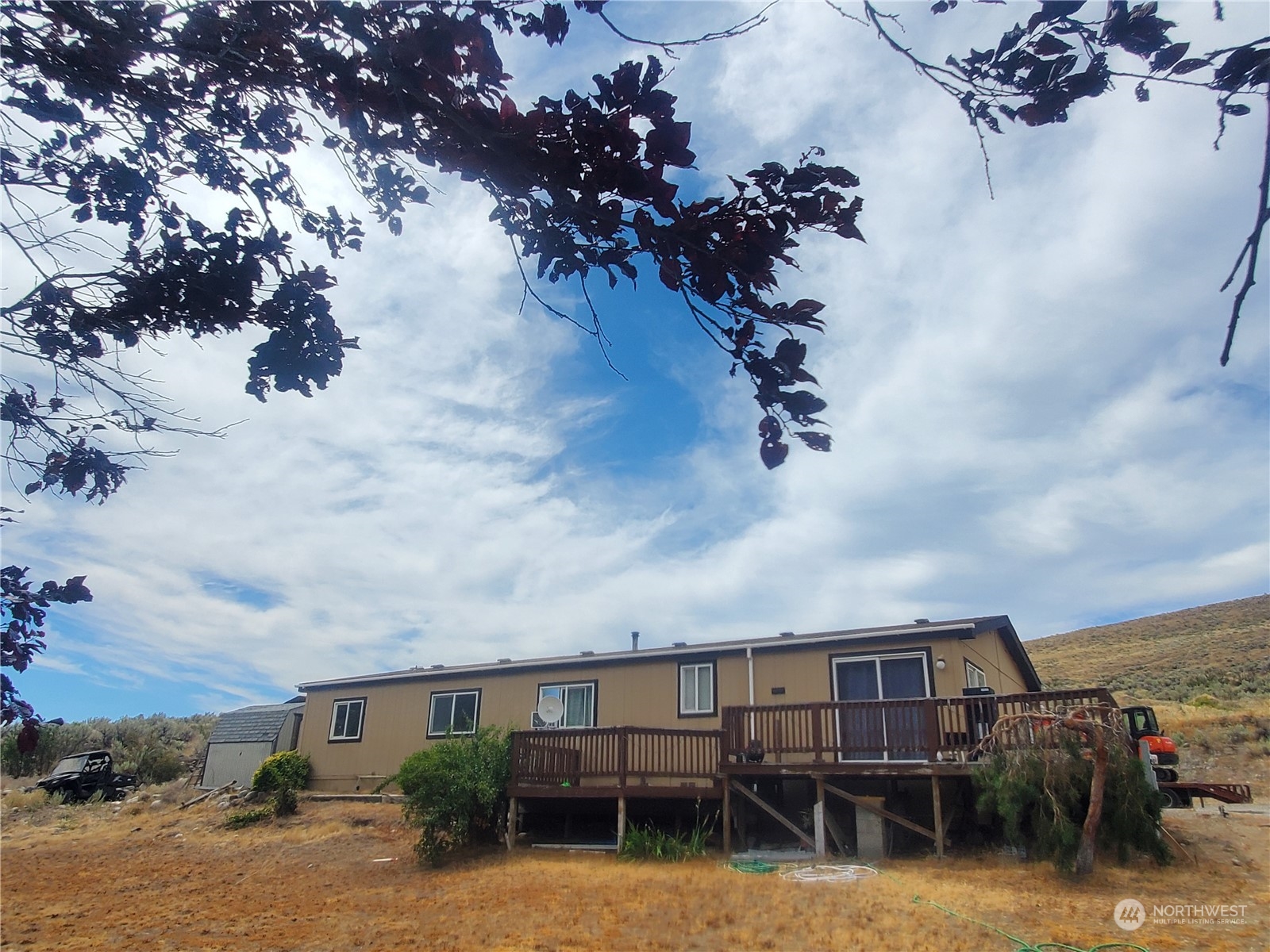 507 Mt Olive Road Riverside, WA 98849 - Photo 2 of 23 a view of a house with roof deck