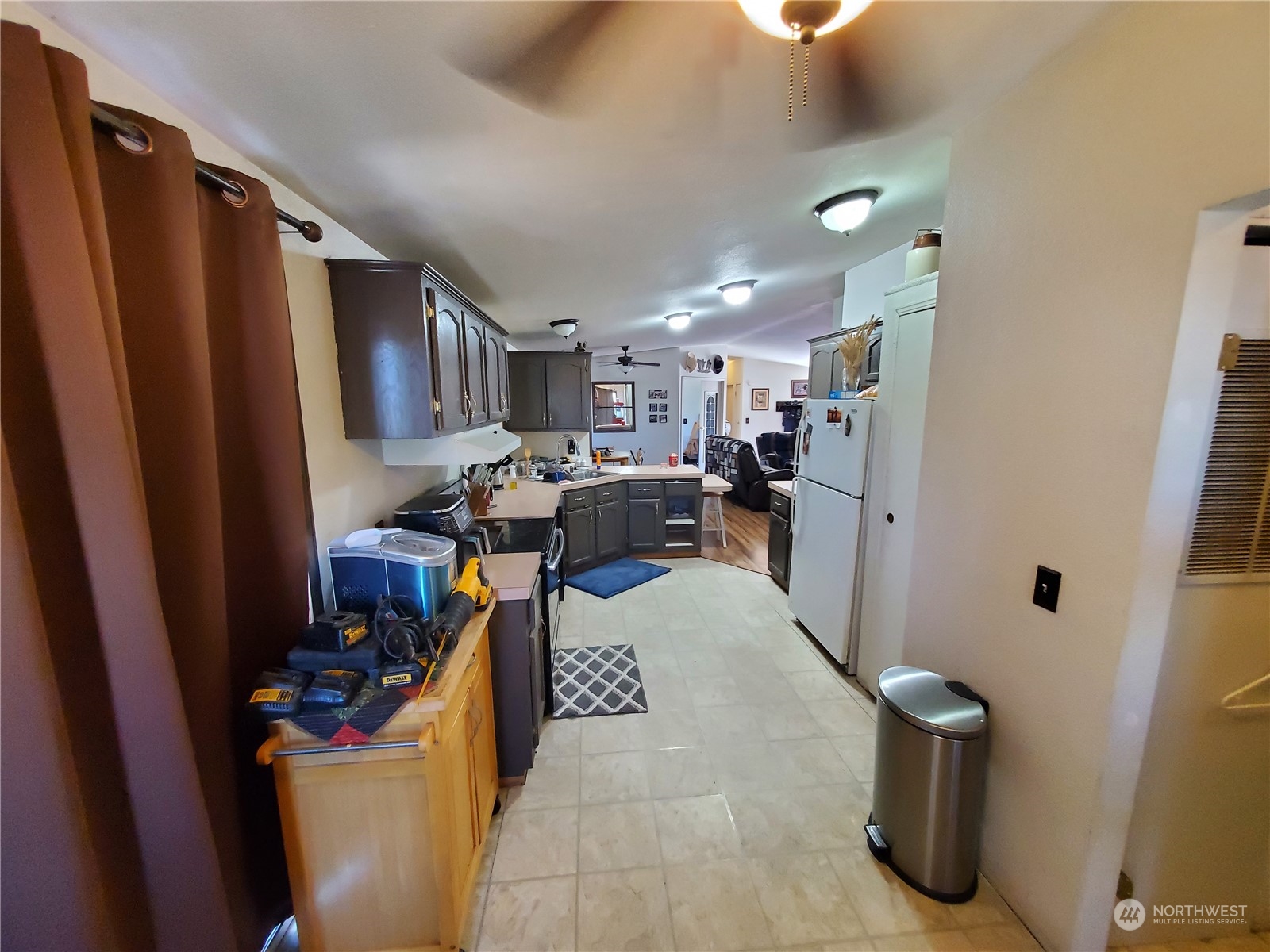 507 Mt Olive Road Riverside, WA 98849 - Photo 8 of 23 a view of a kitchen with fridge and workspace