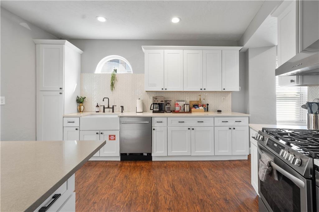 5101 Carnegie Street Pittsburgh, PA 15201 - Photo 14 of 34 a kitchen with a sink a stove and cabinets