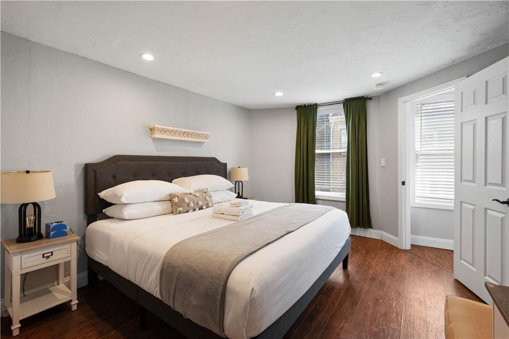 5101 Carnegie Street Pittsburgh, PA 15201 - Photo 16 of 34 a bedroom with a bed and a night stand