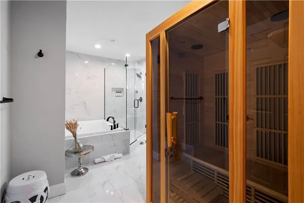 a bathroom with a tub and a shower