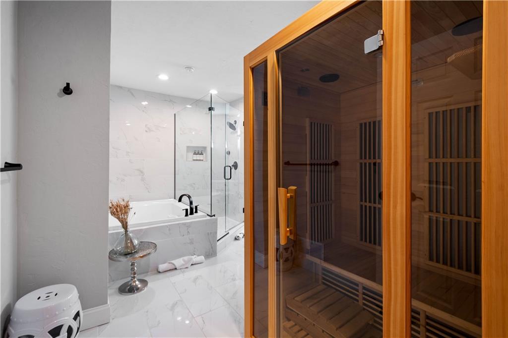 5101 Carnegie Street Pittsburgh, PA 15201 - Photo 21 of 34 a bathroom with a tub and a shower