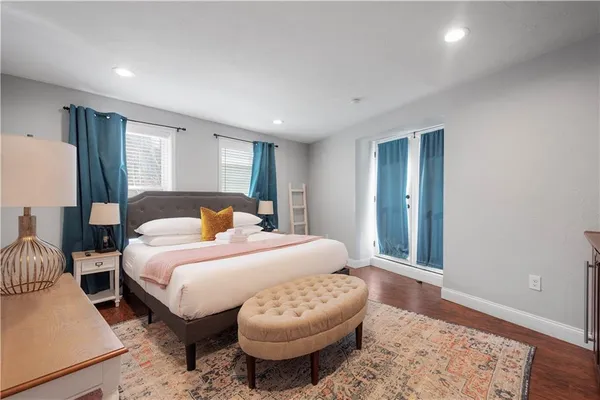 a bedroom with a bed and a couch