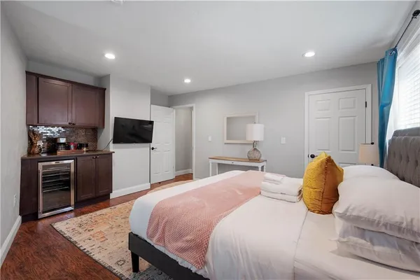 a bedroom with a bed and a television