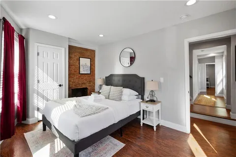 a bedroom with a bed and a dresser