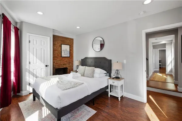 a bedroom with a bed and a dresser