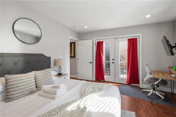 a bedroom with a bed and a chair