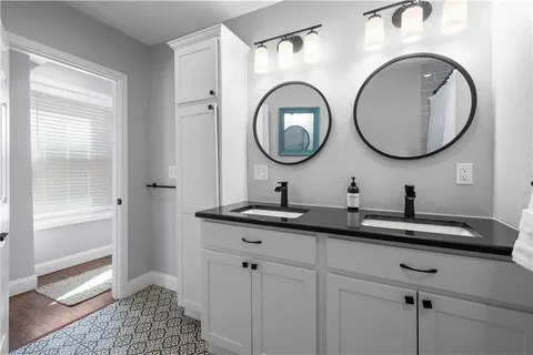 a bathroom with a sink and a mirror