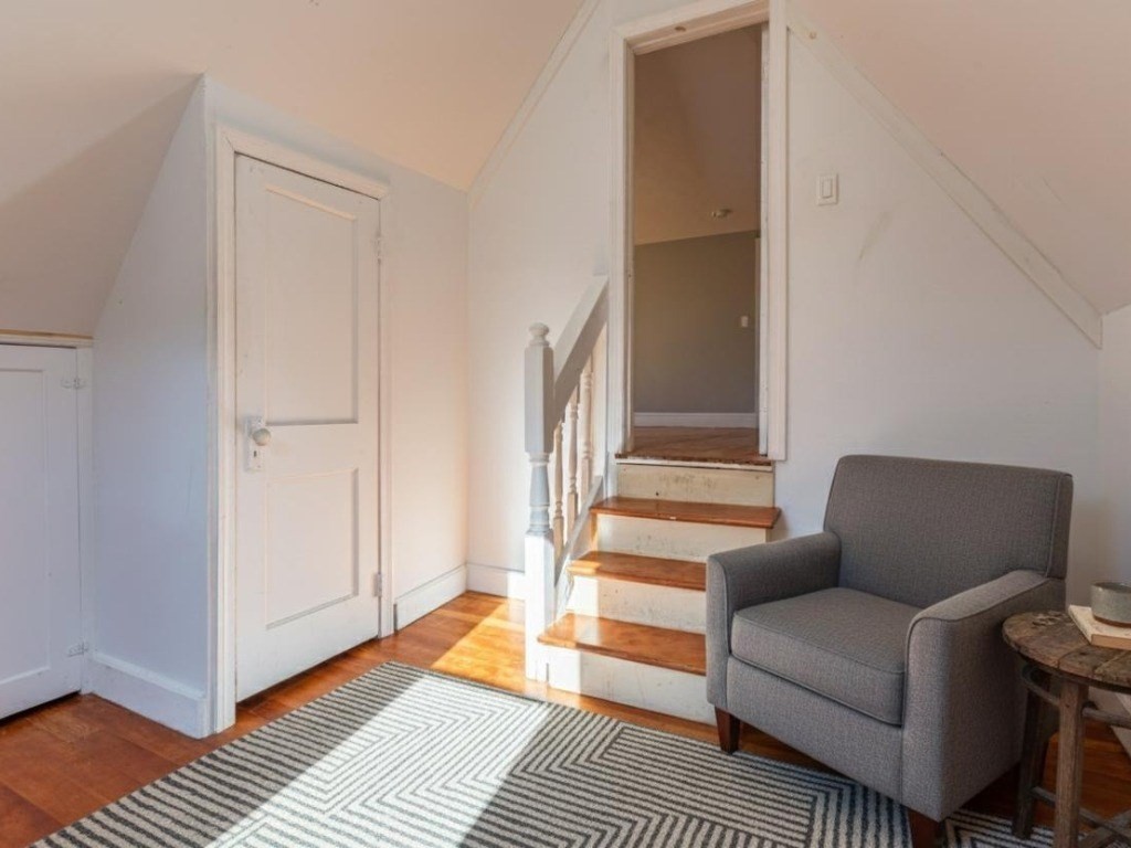 19 Roosevelt Avenue Springfield, MA 01118 - Photo 11 of 27 a living room with furniture and a rug