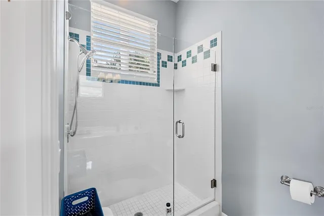 a view of a bedroom with furniture and wooden floor