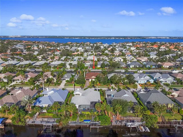 an aerial view of residential houses with outdoor space