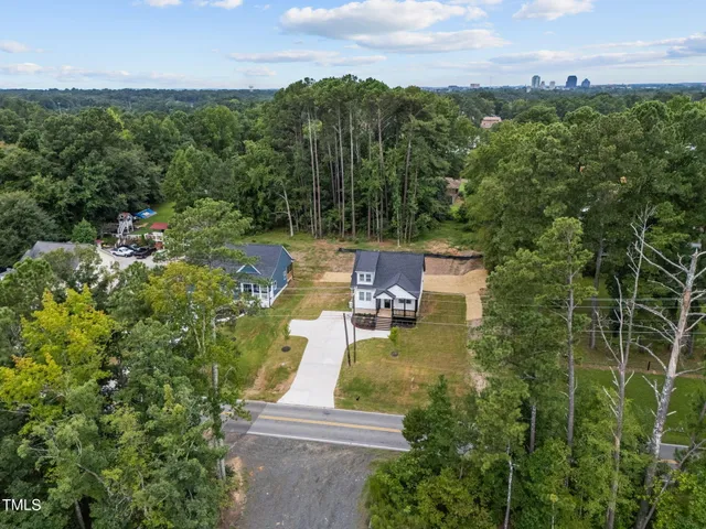 an aerial view of residential house with outdoor space