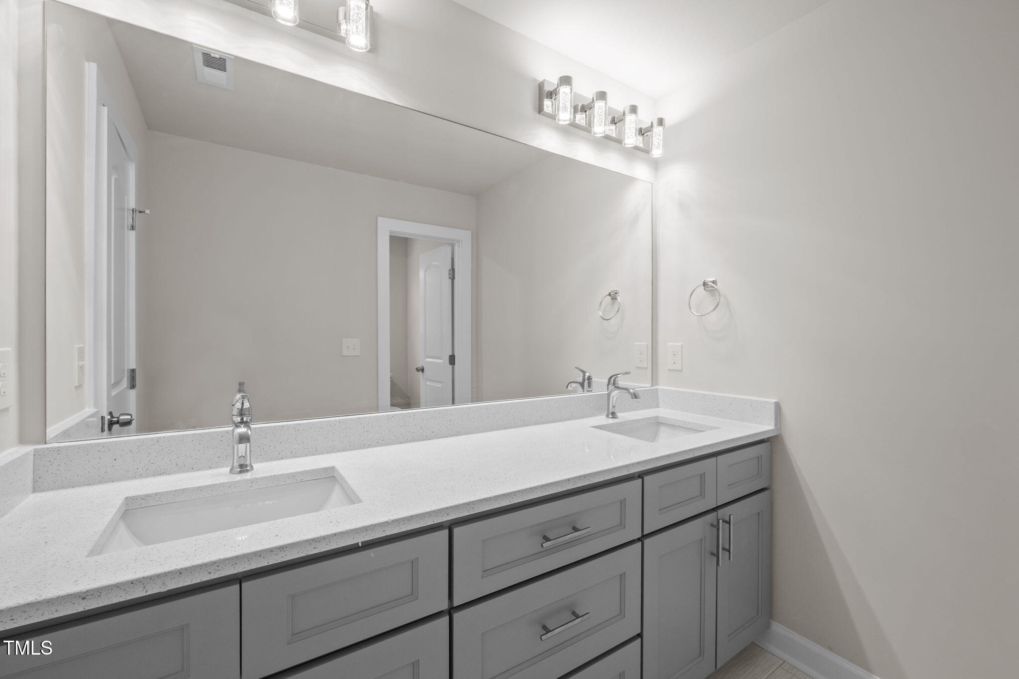 525 North Hoover Road Durham, NC 27703 - Photo 16 of 45 a bathroom with a sink and a mirror