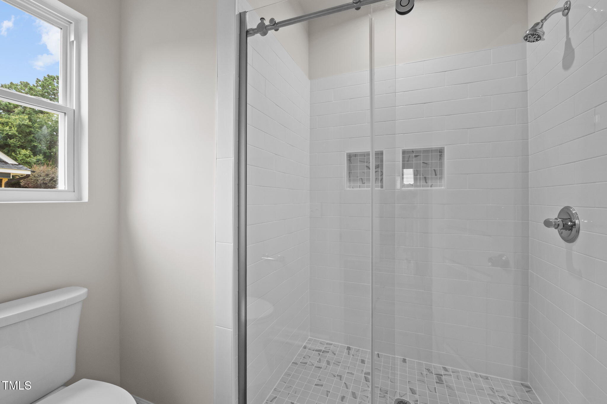 525 North Hoover Road Durham, NC 27703 - Photo 19 of 45 a bathroom with a shower and toilet