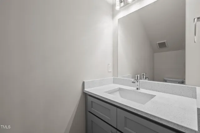 a kitchen with stainless steel appliances granite countertop a sink and dishwasher a stove with wooden floors