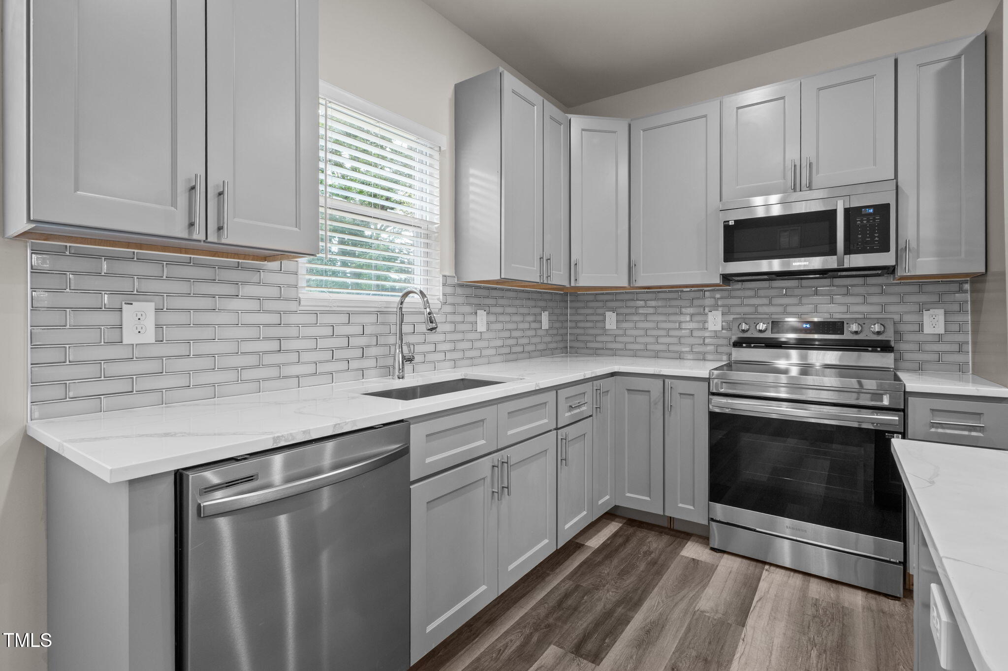 525 North Hoover Road Durham, NC 27703 - Photo 24 of 45 a kitchen with stainless steel appliances granite countertop a sink stove and microwave