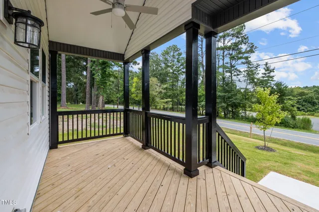 a view of a balcony with a ceiling fan