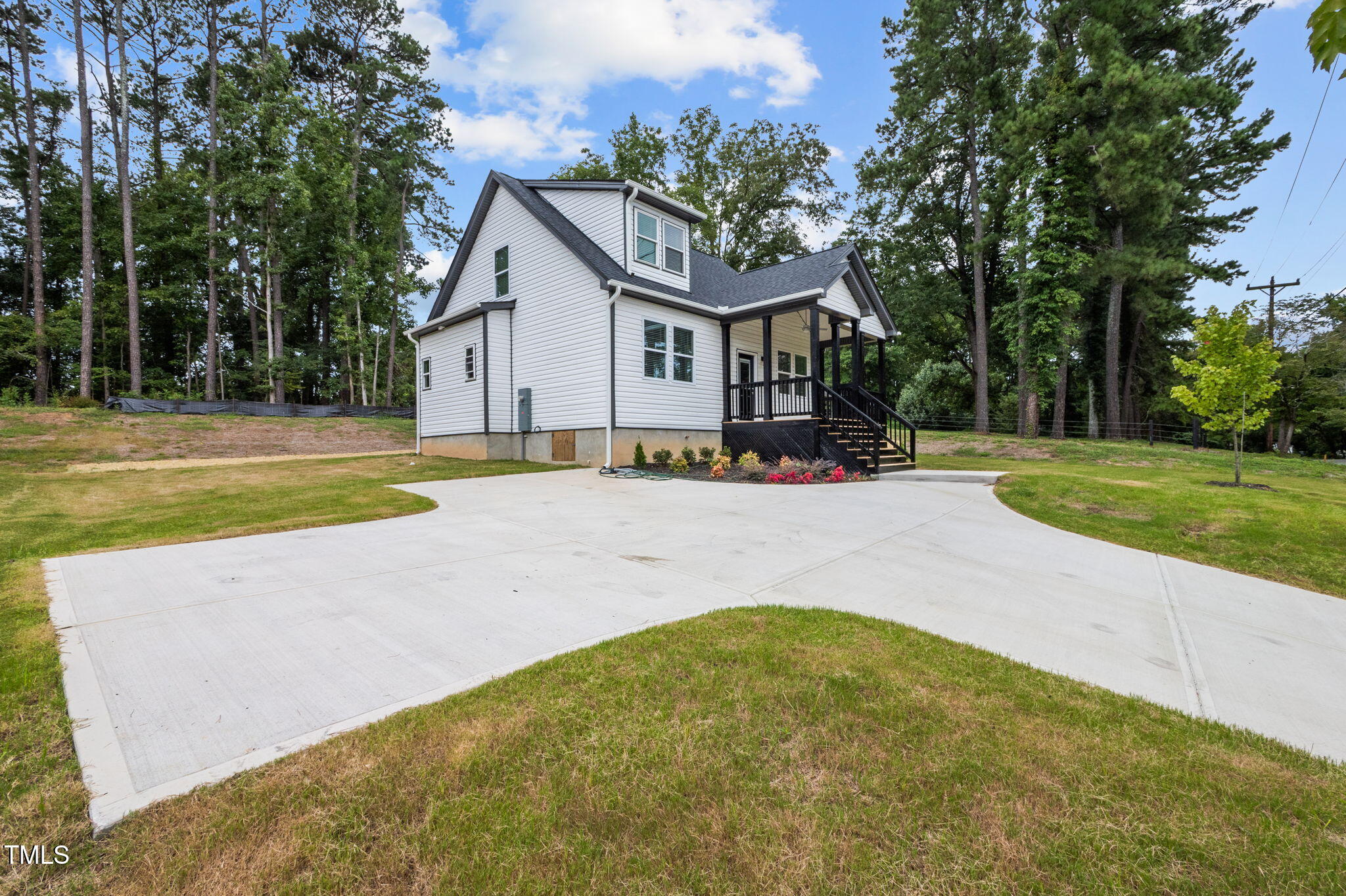 525 North Hoover Road Durham, NC 27703 - Photo 27 of 45 a front view of a house with a yard and trees