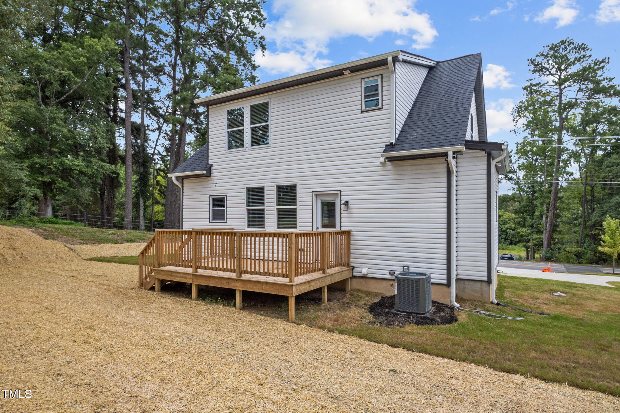 525 North Hoover Road Durham, NC 27703 - Photo 29 of 45 a view of a house with backyard and a tree