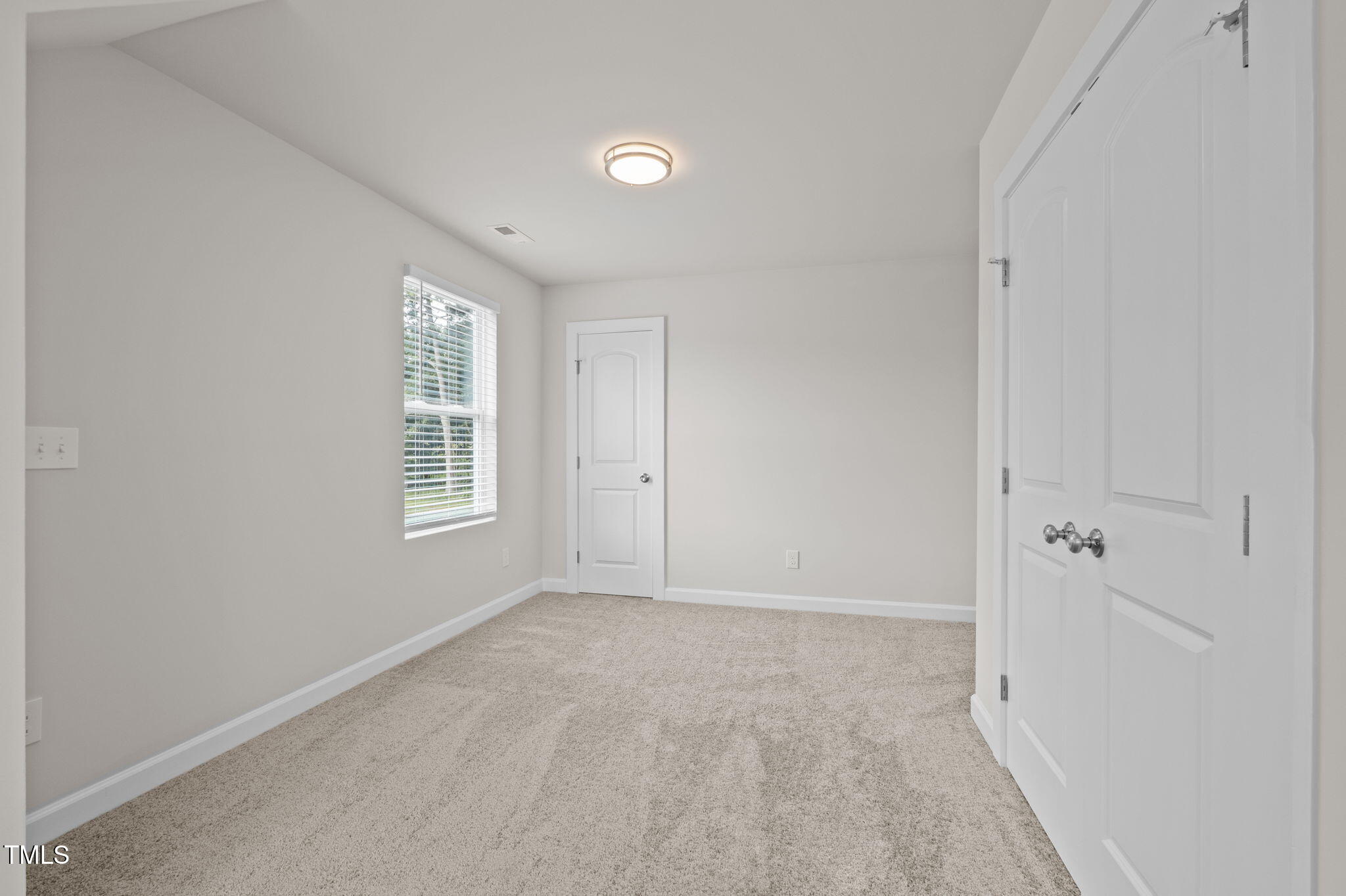 525 North Hoover Road Durham, NC 27703 - Photo 31 of 45 an empty room with windows and closet
