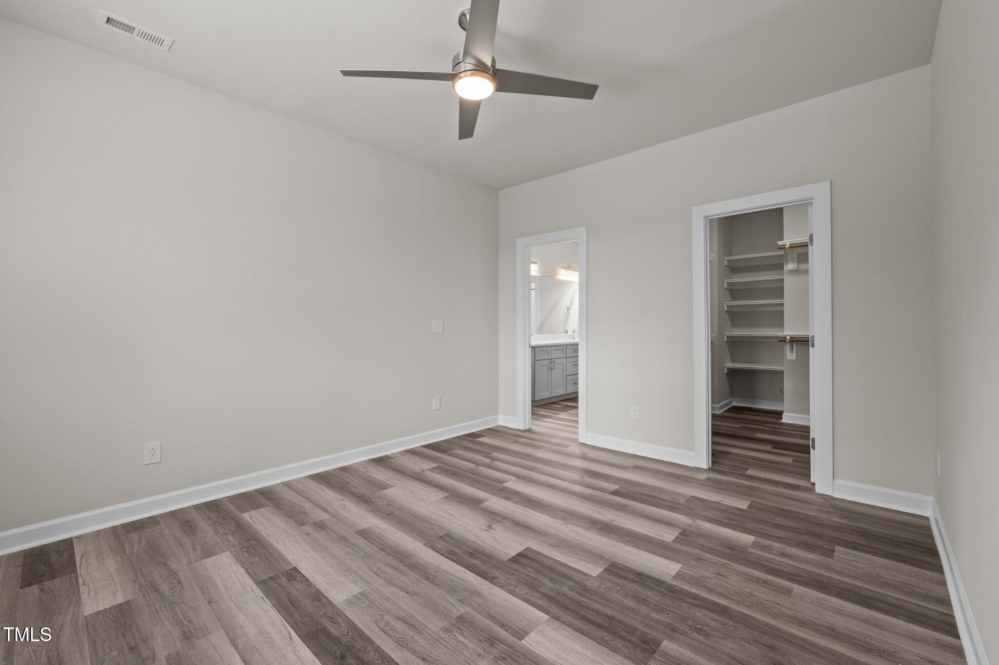 525 North Hoover Road Durham, NC 27703 - Photo 37 of 45 a view of an empty room with wooden floor and a ceiling fan
