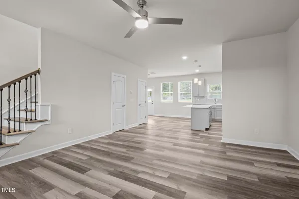 a kitchen with a refrigerator a sink and cabinets