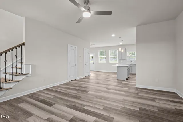 a kitchen with a refrigerator a sink and cabinets