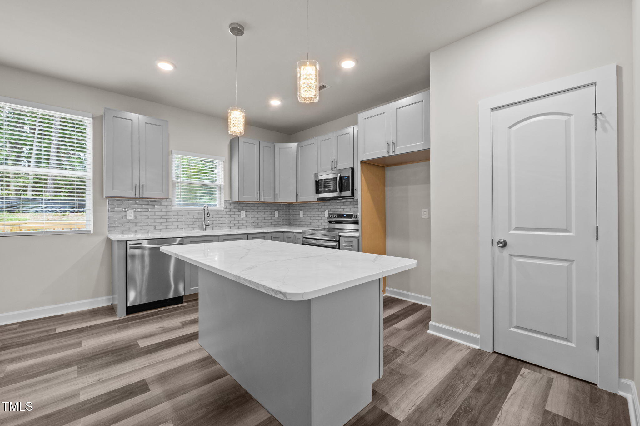 525 North Hoover Road Durham, NC 27703 - Photo 43 of 45 a kitchen with a refrigerator a sink and cabinets