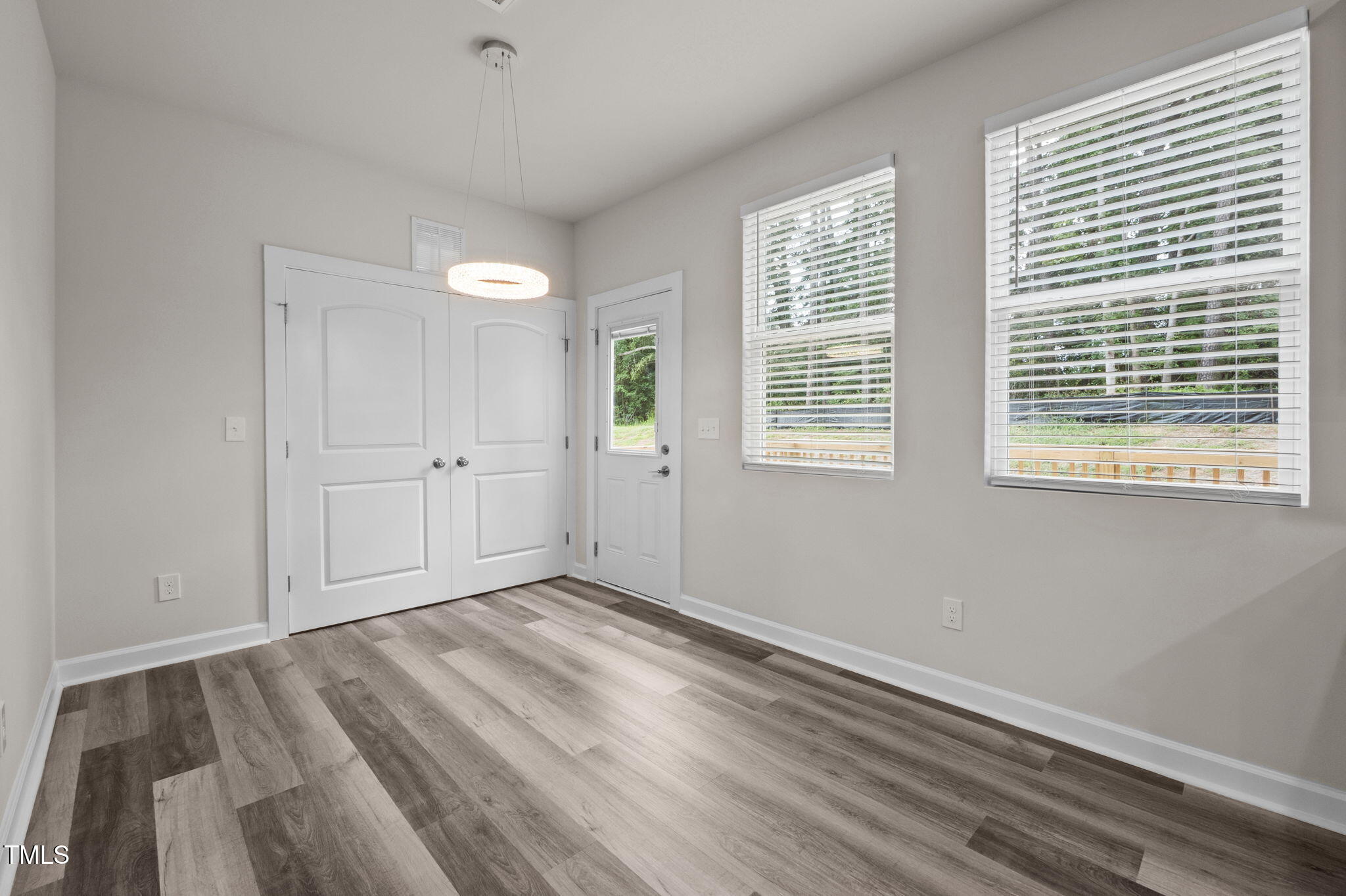 525 North Hoover Road Durham, NC 27703 - Photo 44 of 45 a view of an empty room with wooden floor and a window
