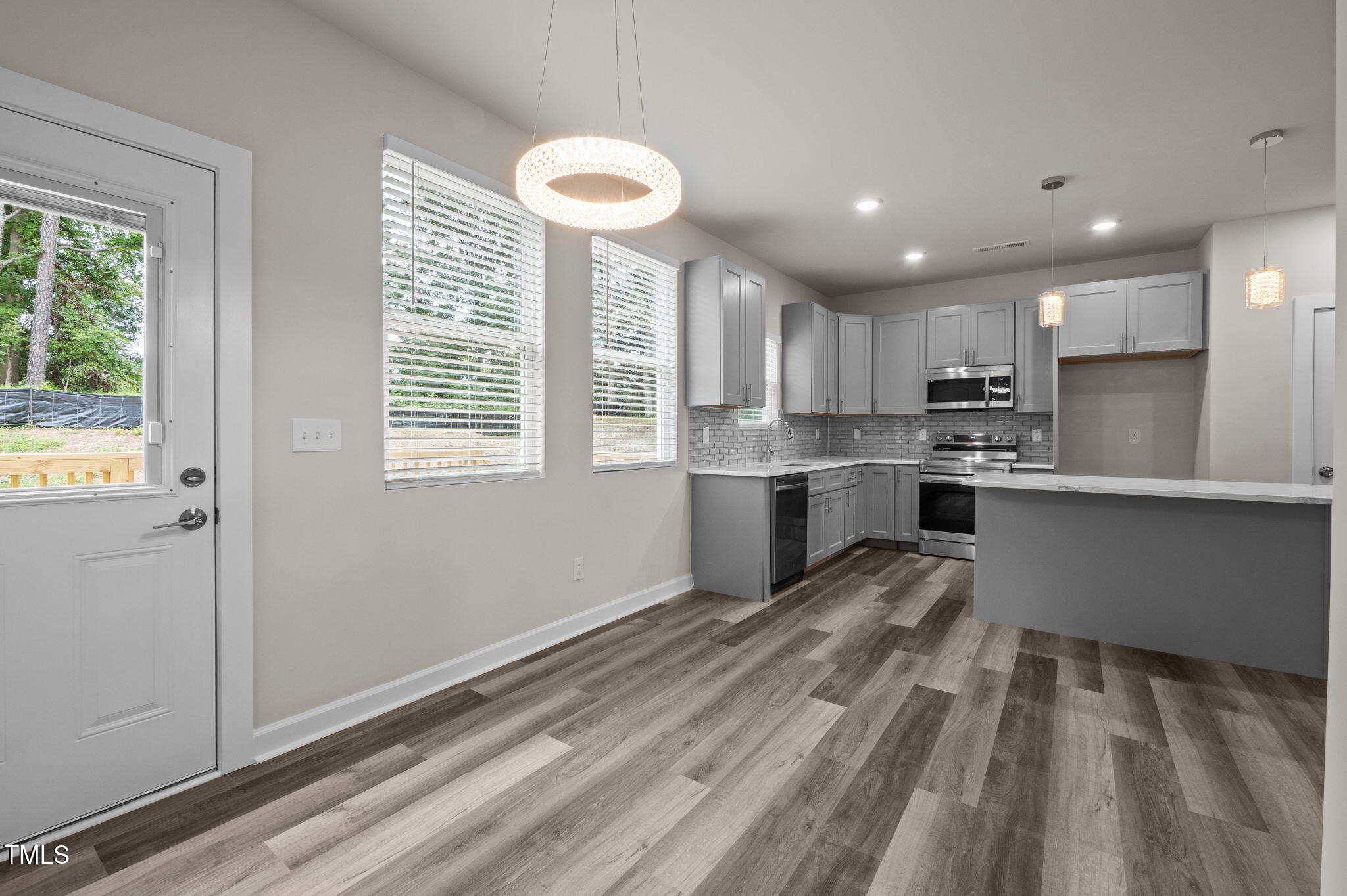 525 North Hoover Road Durham, NC 27703 - Photo 45 of 45 a kitchen with stainless steel appliances granite countertop a stove a sink and a refrigerator
