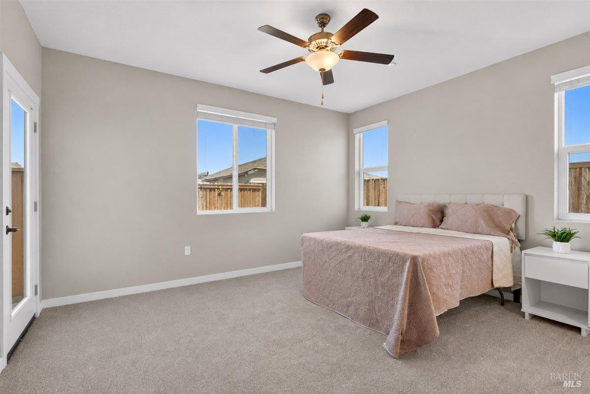 2275 Revival Lane Rio Vista, CA 94571 - Photo 12 of 31 a bedroom with a bed and a ceiling fan