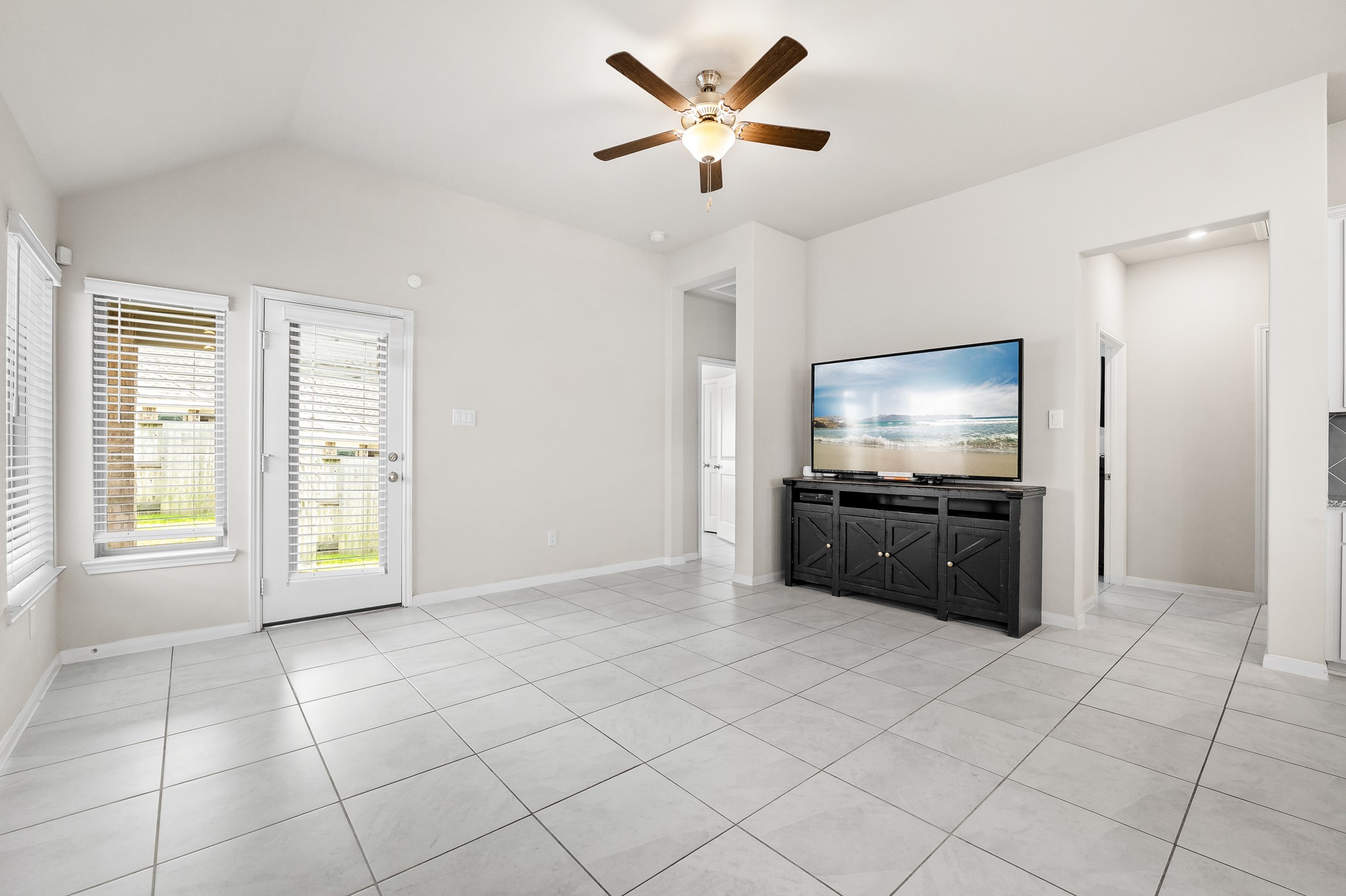 3722 Amoroso Drive Rosharon, TX 77583 - Photo 11 of 27 a living room with furniture and a flat screen tv