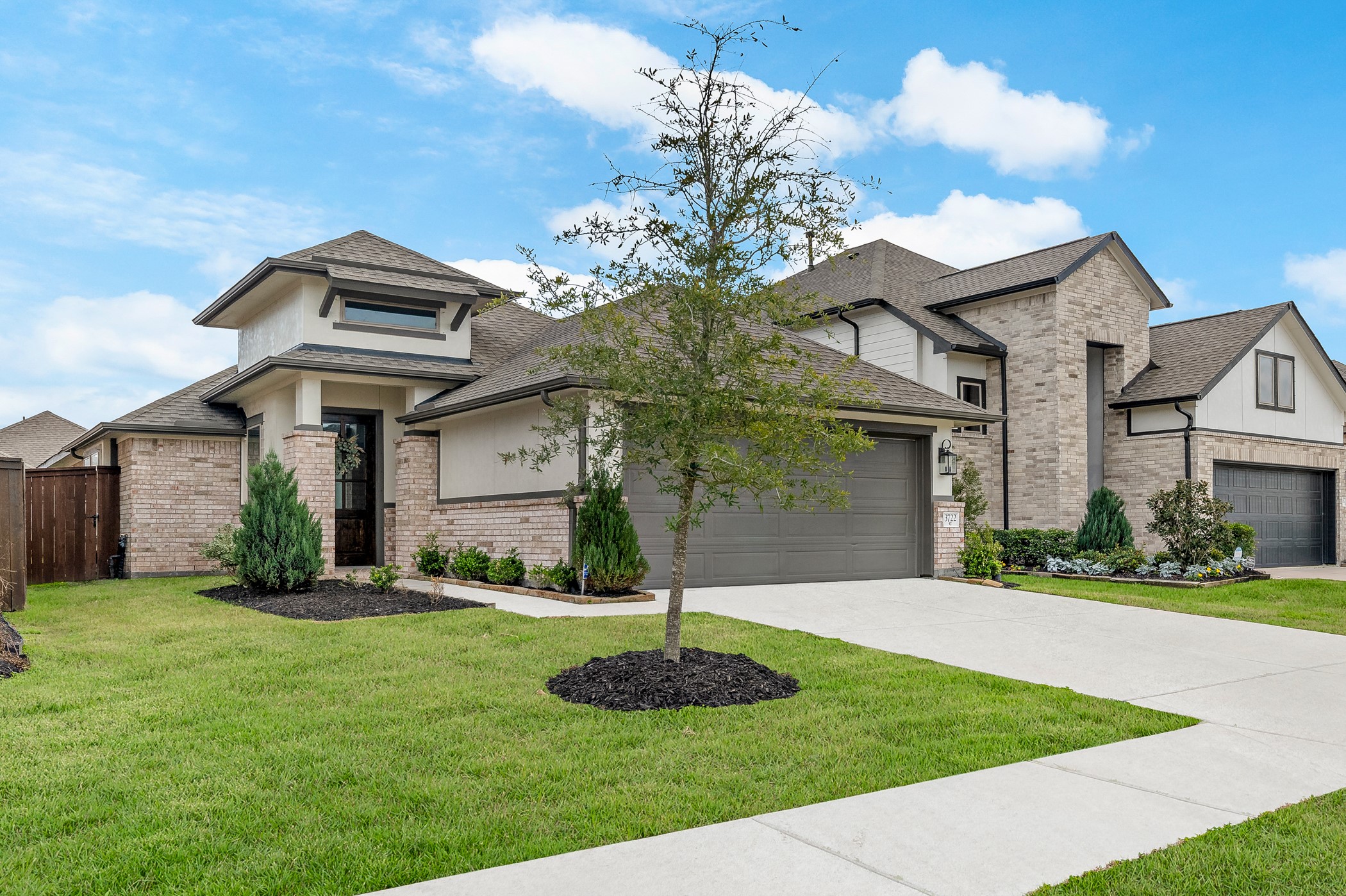3722 Amoroso Drive Rosharon, TX 77583 - Photo 2 of 27 a front view of a house with a yard and garage
