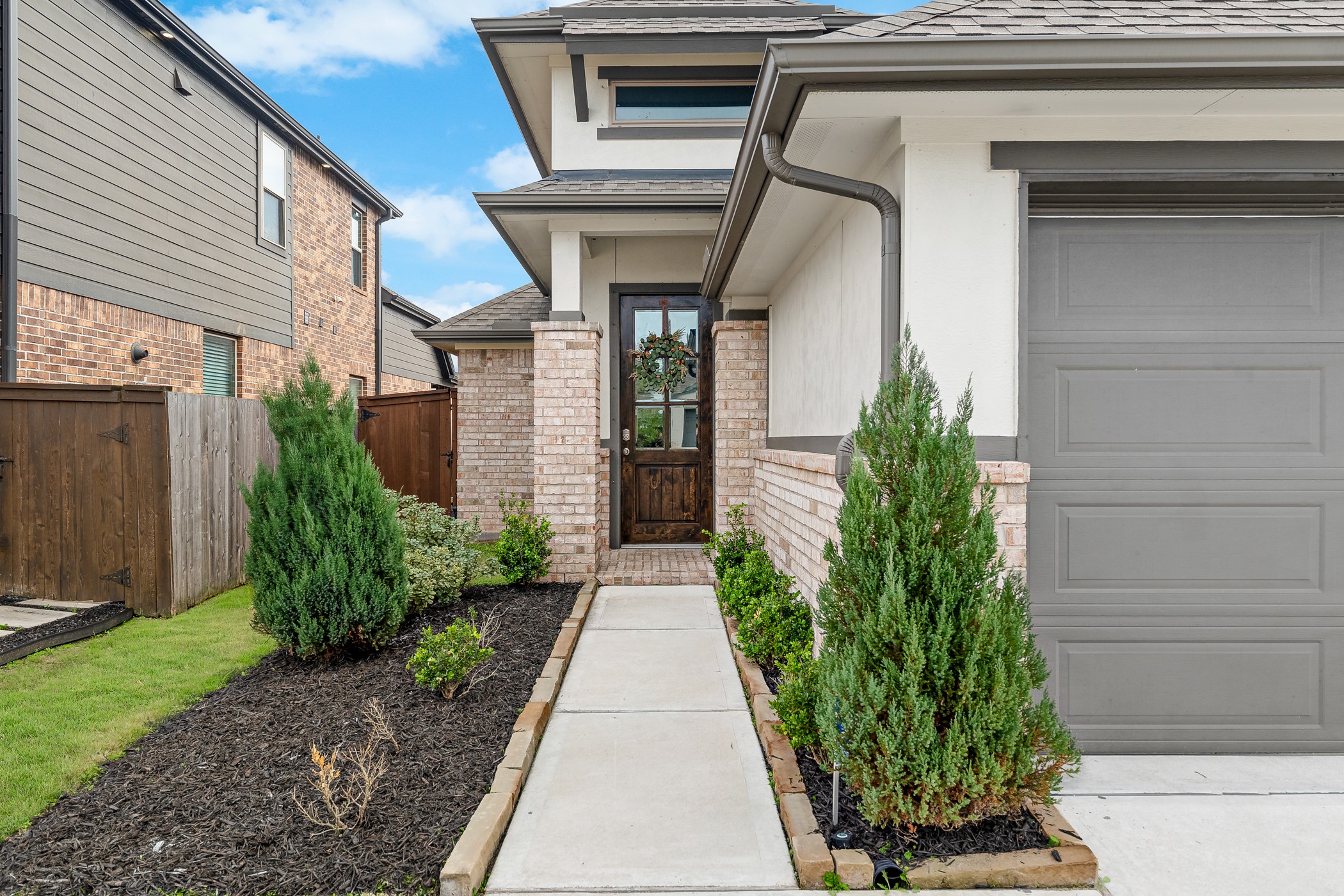 3722 Amoroso Drive Rosharon, TX 77583 - Photo 4 of 27 a pathway of a house with potted plants